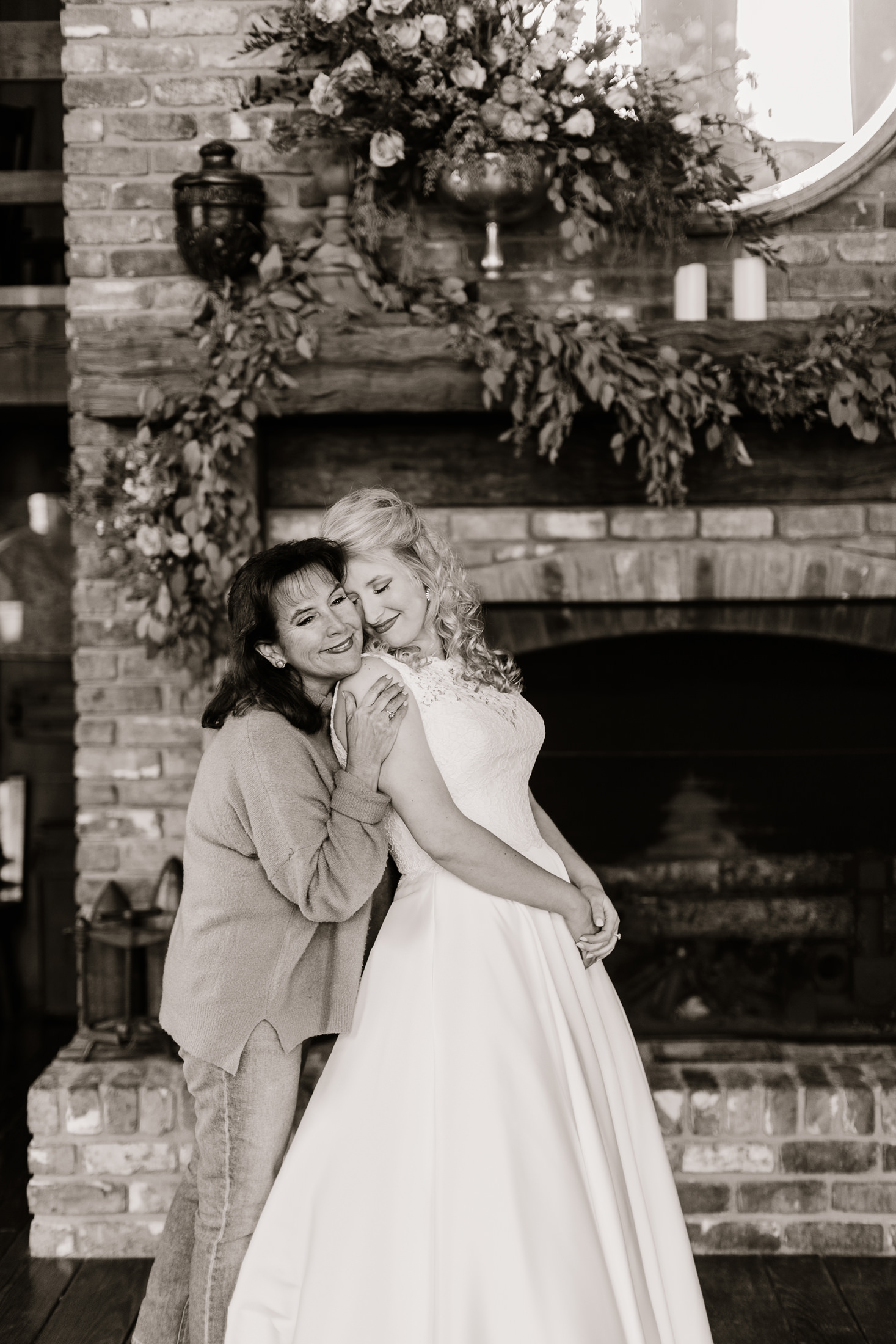 Mother and daughter hugging in sweet getting ready moment on a bride's wedding day in Hattiesburg MS
